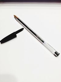Close-up of crane on table against white background