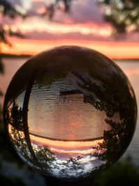 Close-up of water against sky at sunset