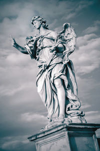 Low angle view of statue against sky