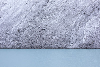 View of lake by rock formation