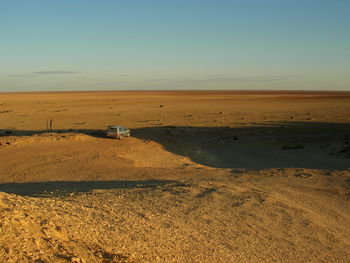 Scenic view of desert against clear sky