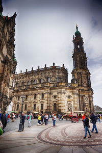 Group of people in front of historical building