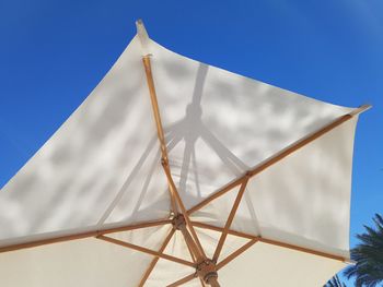 Low angle view of built structure against blue sky