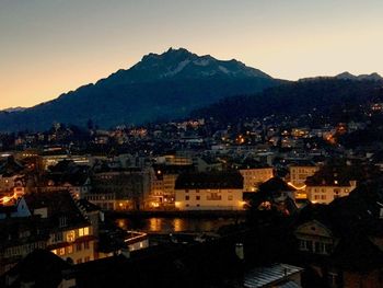 Cityscape with mountain range in background