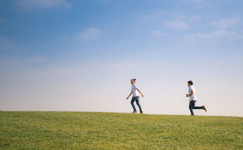 People on field against sky