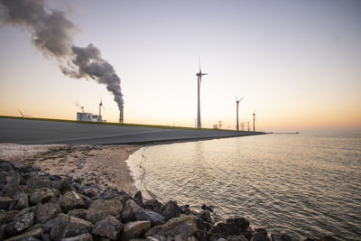 Scenic view of wind turbines at the sea