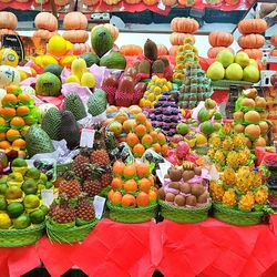 Multi colored fruits for sale at market stall