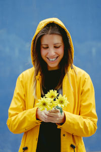 Portrait of young woman with bouquet