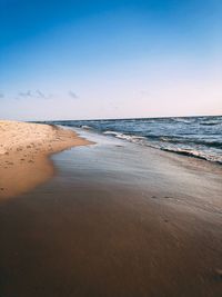 Scenic view of beach against clear sky