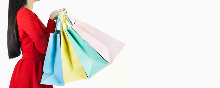 Close-up of multi colored umbrella against white background