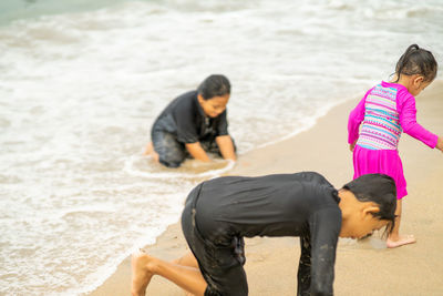 Rear view of women on beach