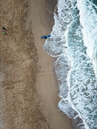 High angle view of surf on beach