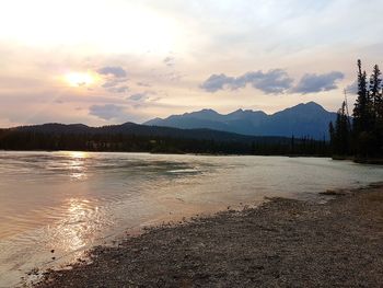 Scenic view of lake against sky during sunset