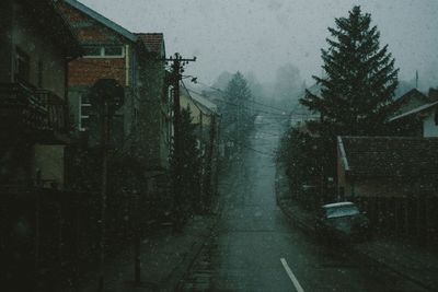 Wet road against sky during winter