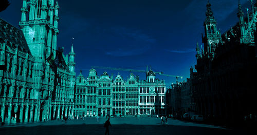 Illuminated buildings in city at night