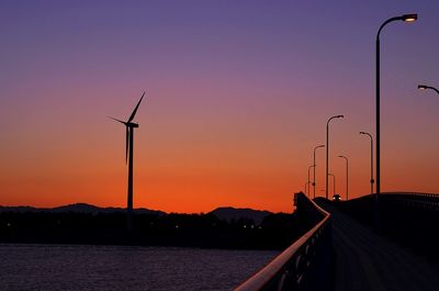 Silhouette of street light against sky during sunset