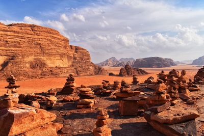 View of rock formations against cloudy sky
