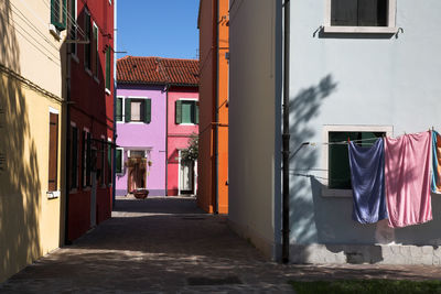 Walkway amidst buildings in town