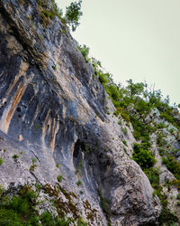 Low angle view of rock formation against sky