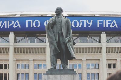 Low angle view of statue against building