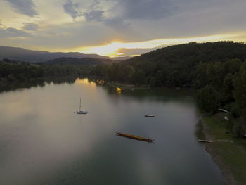 Scenic view of lake against sky during sunset