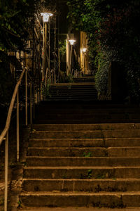 Low angle view of staircase in building at night