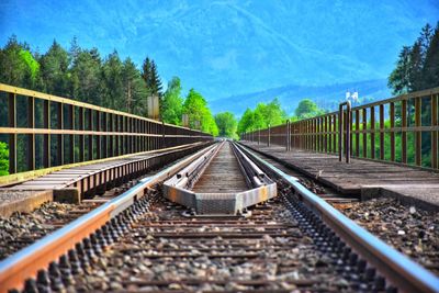 Surface level of railroad track against sky