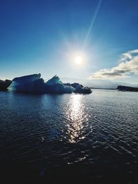 Scenic view of sea against sky at sunset