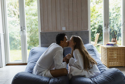 Couple relaxing together in living room