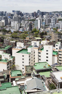 High angle view of buildings in city against sky