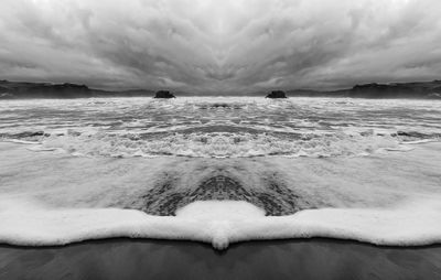 Scenic view of sea against cloudy sky