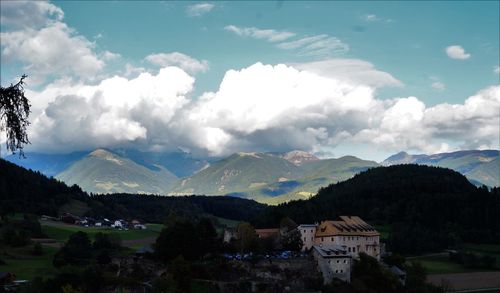 Scenic view of mountains against cloudy sky
