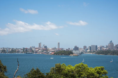 Scenic view of sea and buildings against sky