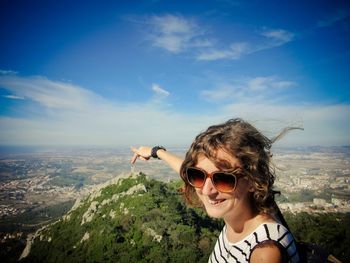 Portrait of woman against sky