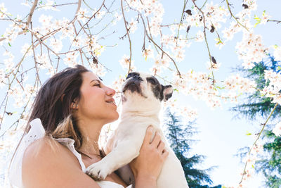 Portrait of young woman with dog