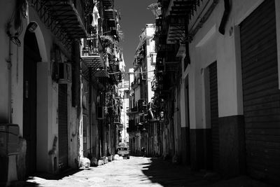 Narrow alley amidst buildings in city