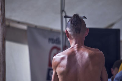 Rear view of shirtless man