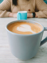 Close-up of coffee cup on table