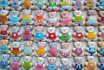 Directly above shot of colorful teddy bear shape christmas cookies at market stall