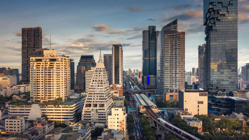 High angle view of buildings in city against sky