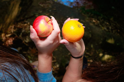 Close-up of hand holding apple