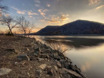 Scenic view of lake against sky during sunset