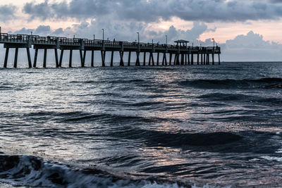 Pier over sea against sky