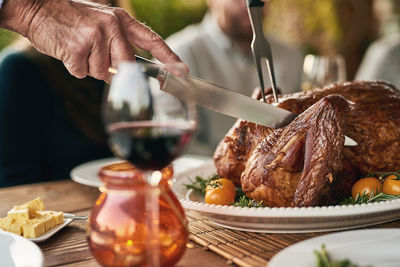 Midsection of man preparing food on table