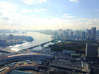 High angle view of city against cloudy sky