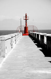 View of pier over sea against sky