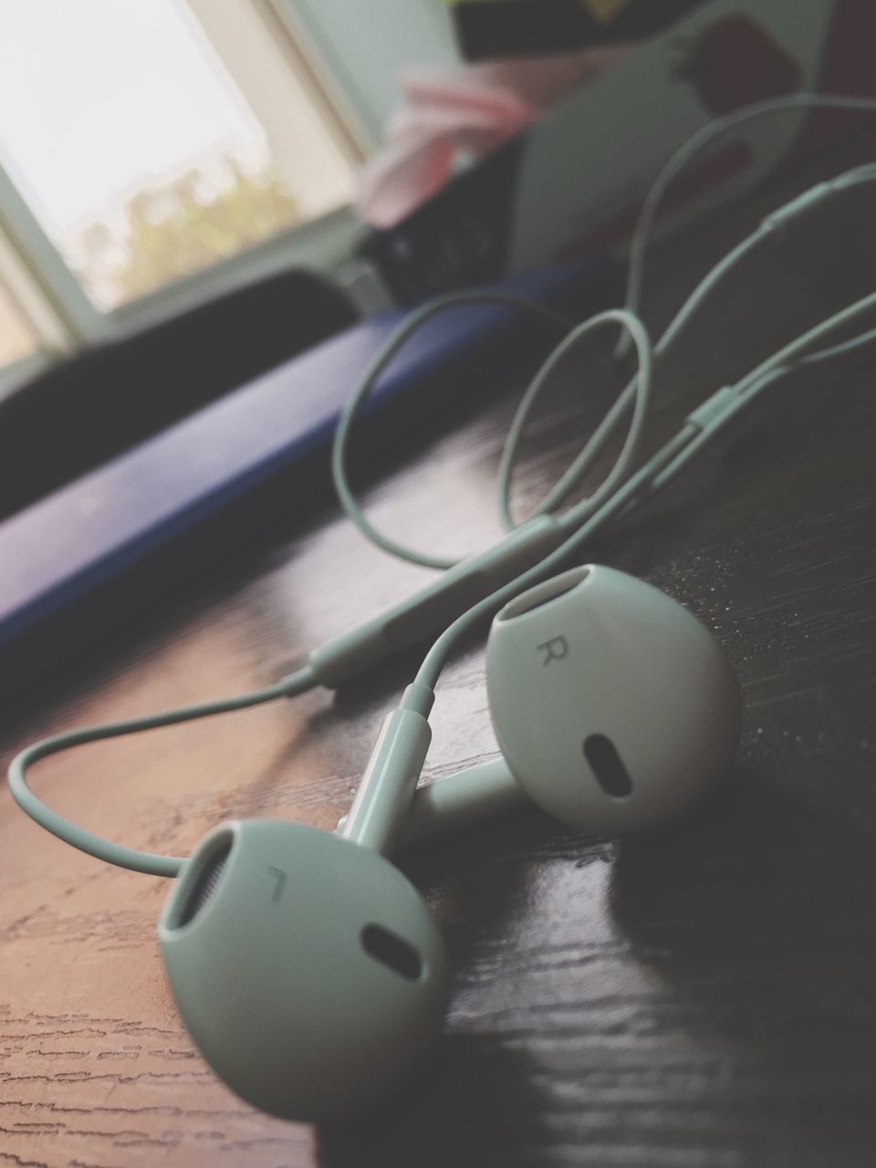 indoors, still life, table, close-up, focus on foreground, technology, single object, no people, metal, toy, home interior, selective focus, old-fashioned, retro styled, man made object, connection, equipment, high angle view, music, arts culture and entertainment