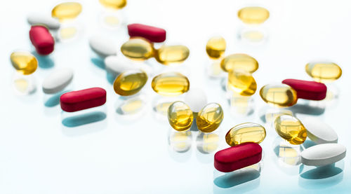 Close-up of pills on white background