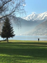 Scenic view of lake against snowcapped mountain