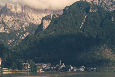 Scenic view of lake and mountains in alleghe, italian dolomites